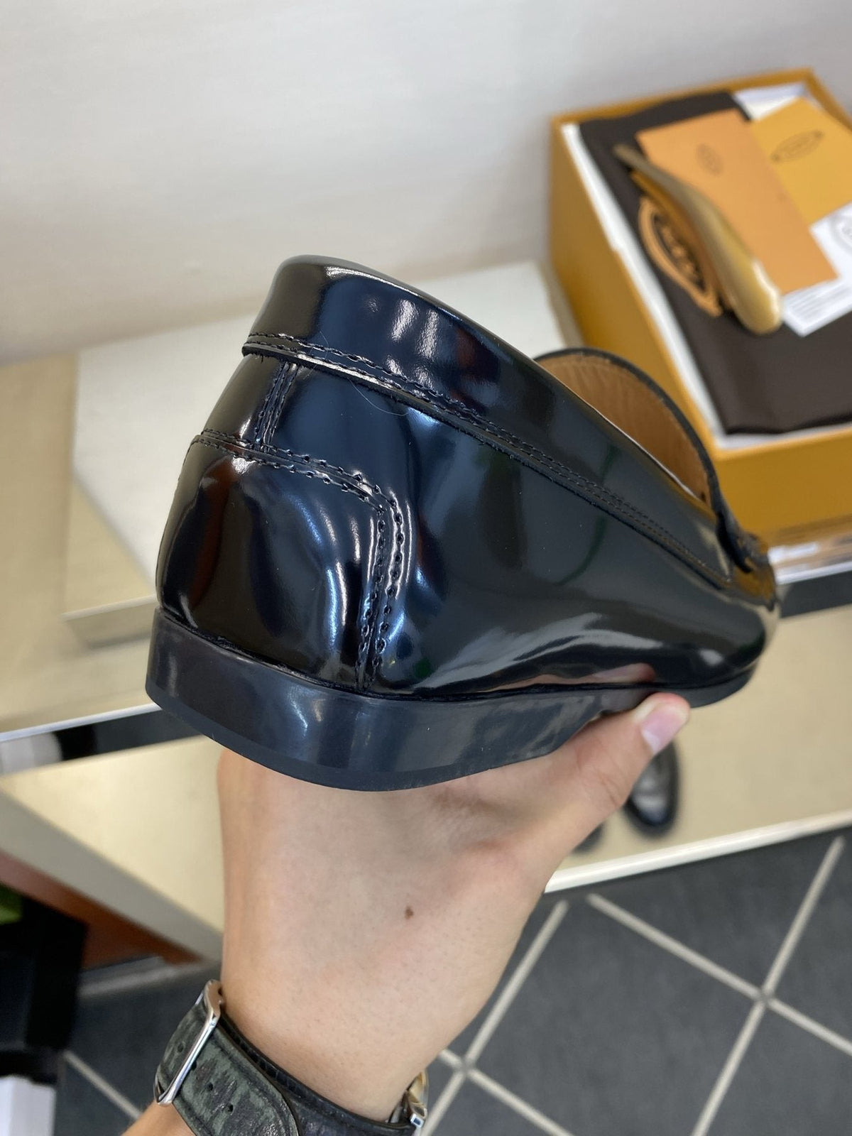 Tod's Glossy Dark Navy Penny Loafers — side