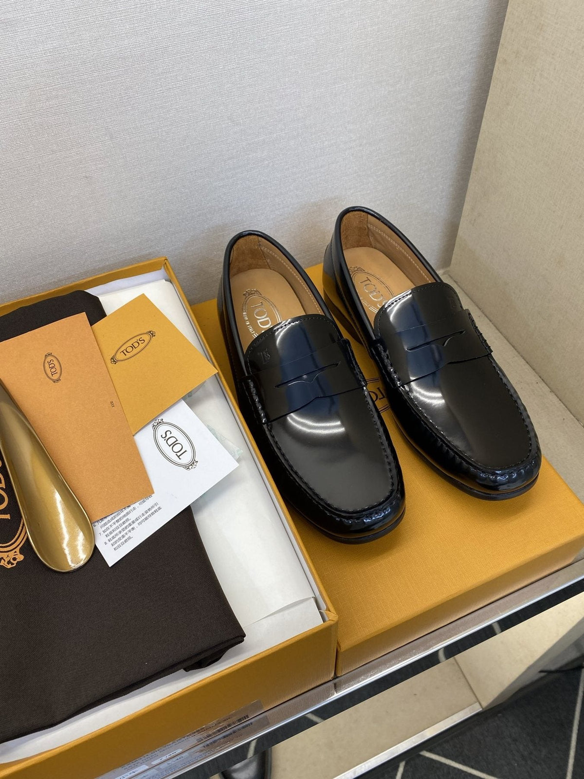 Tod's Glossy Dark Navy Penny Loafers — front