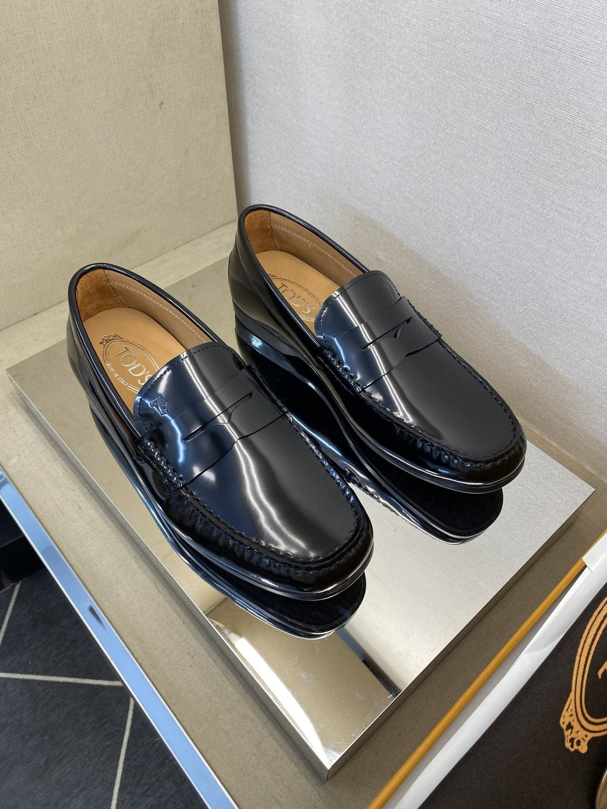 Tod's Glossy Dark Navy Penny Loafers — front