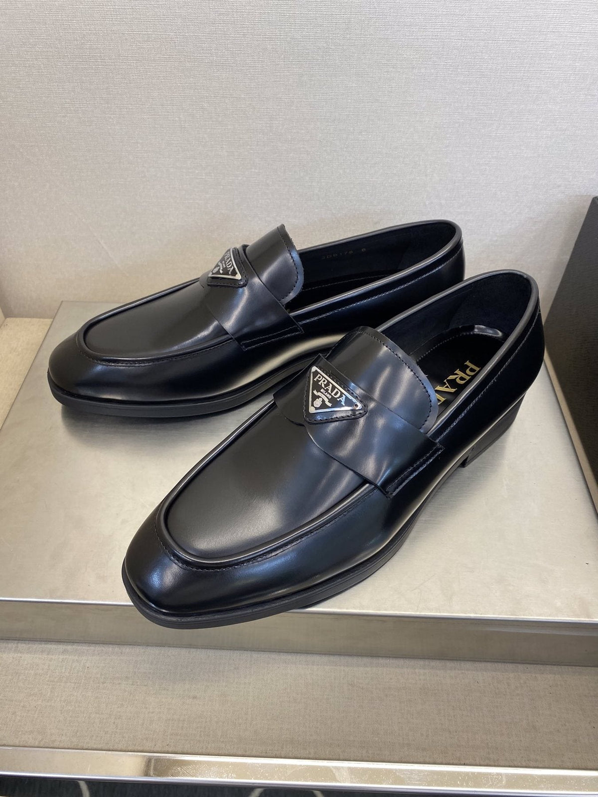 Prada Black Triangle Plaque Loafers — front