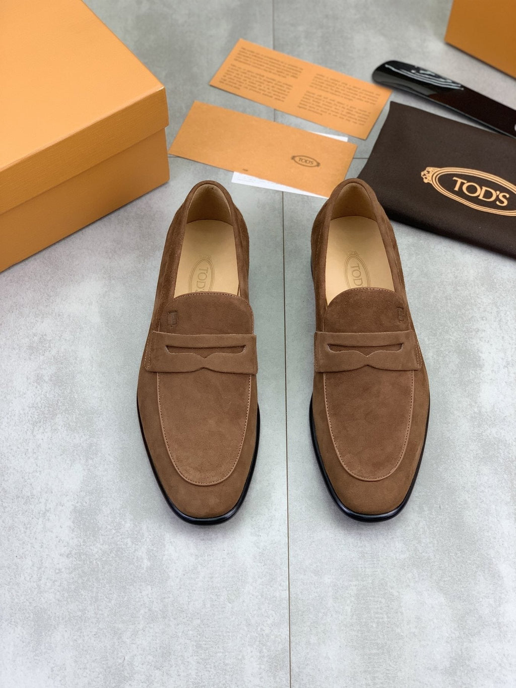Tod's Brown Suede Penny Loafers — model