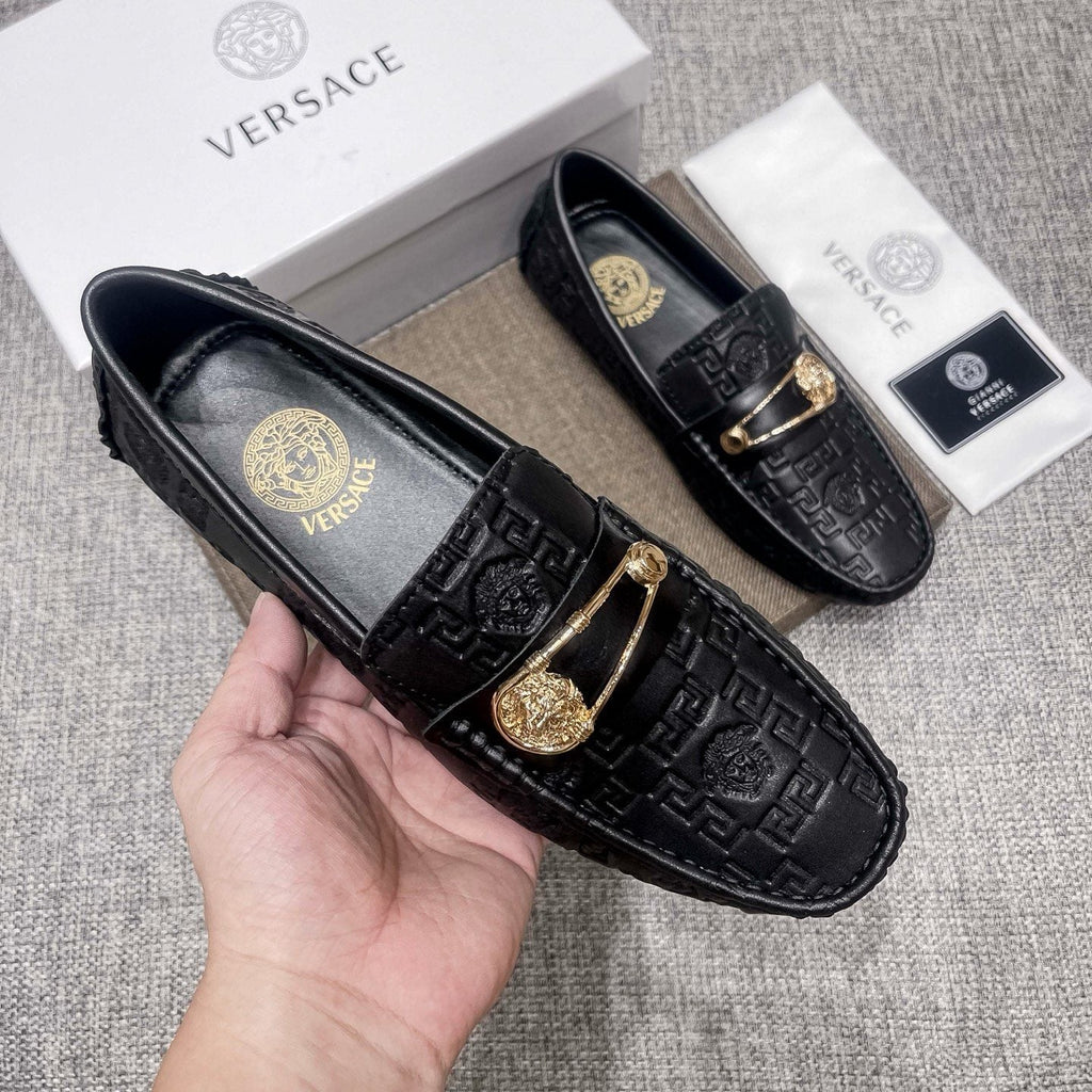 Versace Embossed Medallion Loafers — model