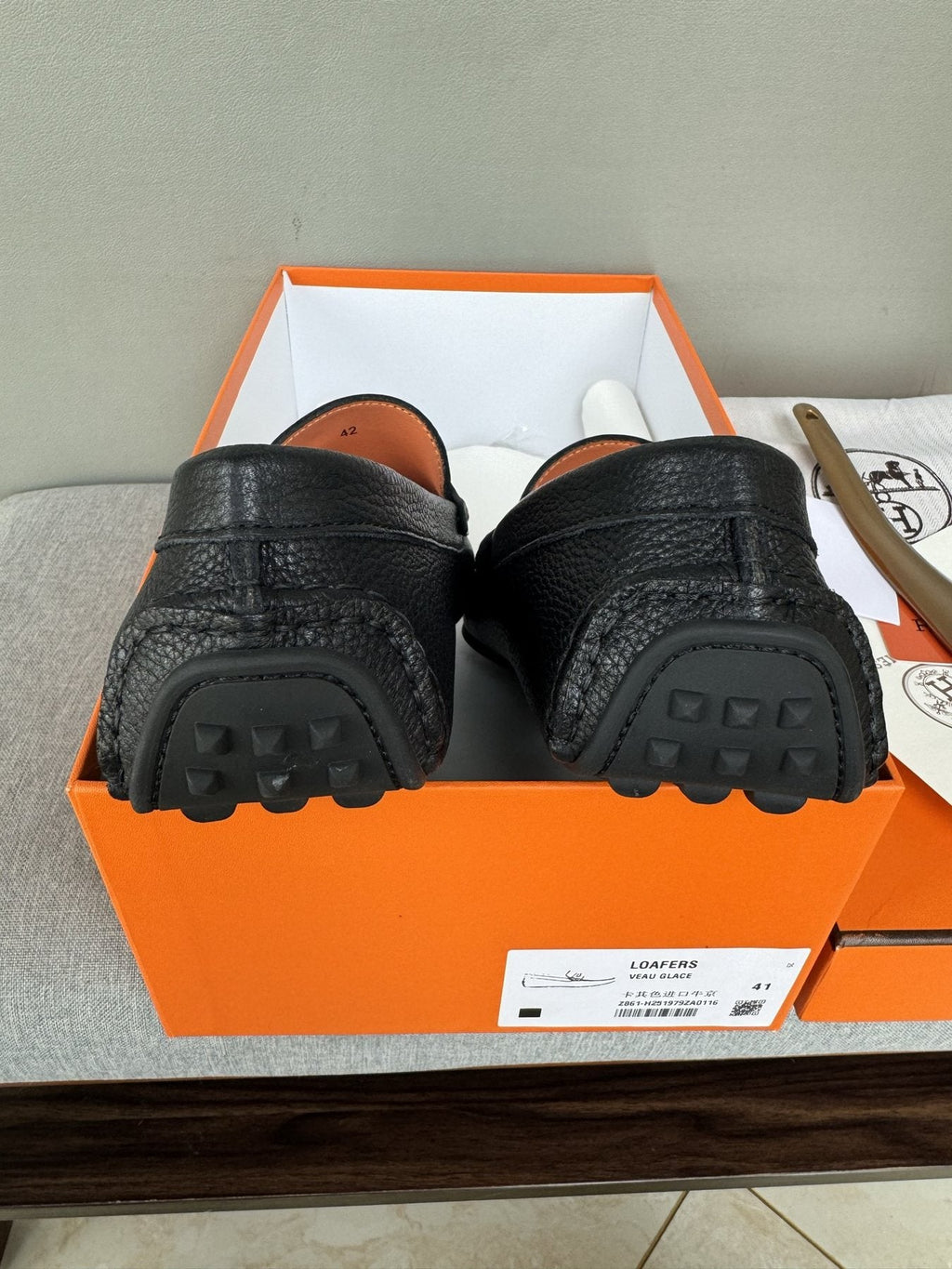 Hermès Black Textured Penny Loafers — detail
