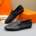 Hermès Black Pebbled Leather H-Hardware Loafers — front