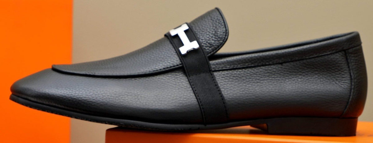 Hermès Black Pebbled Leather H-Hardware Loafers — hero