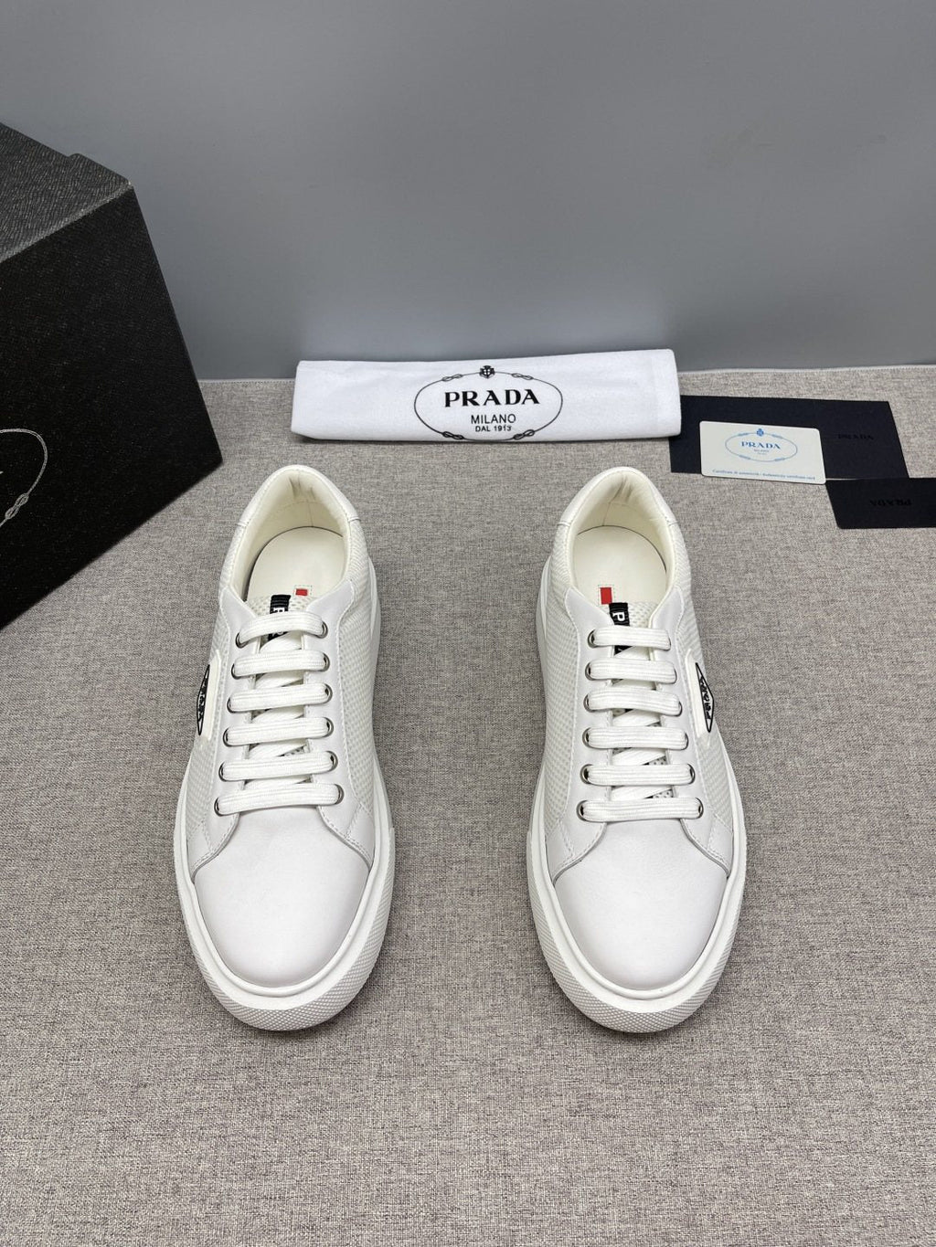 Prada Triangle Patch Low-Top Sneakers — front