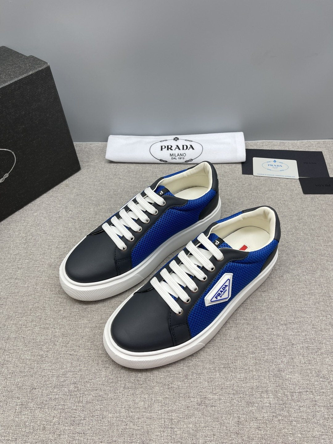 Prada Triangle Patch Low-Top Sneakers — front