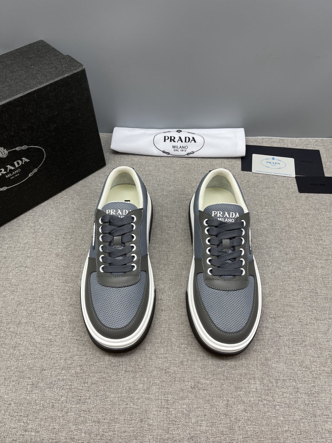 Prada Triangle Patch Low-Top Sneakers — front
