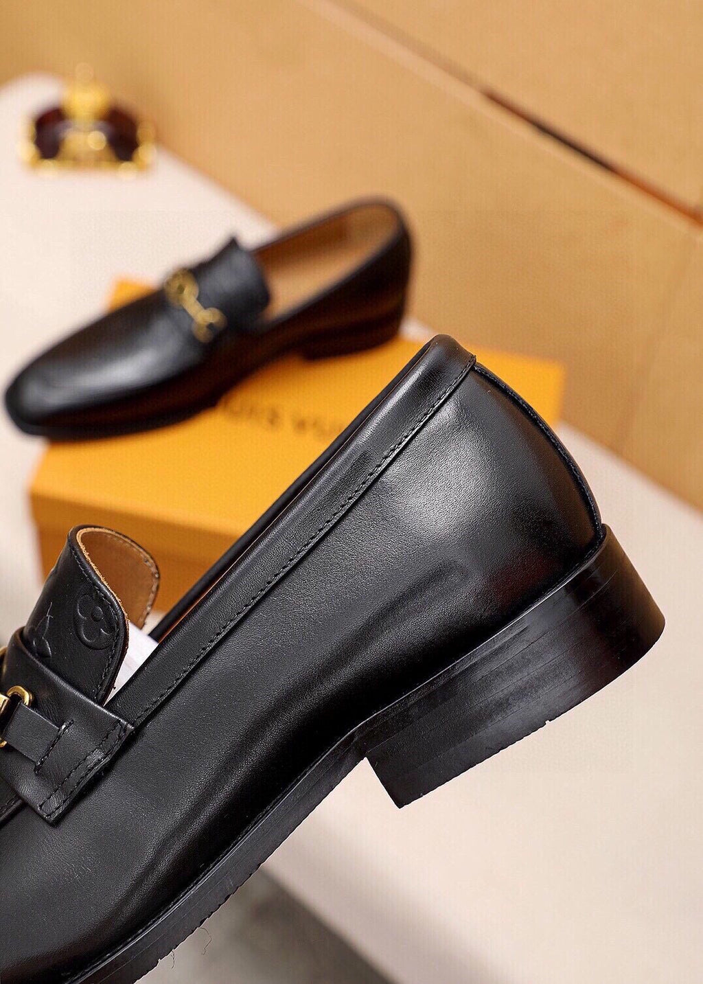 Louis Vuitton Embossed Buckle Loafers — side