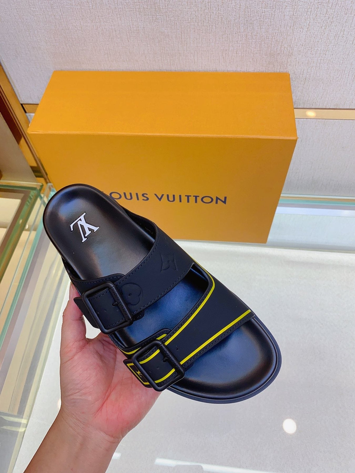 Louis Vuitton Two-Buckle Slide Sandals — model