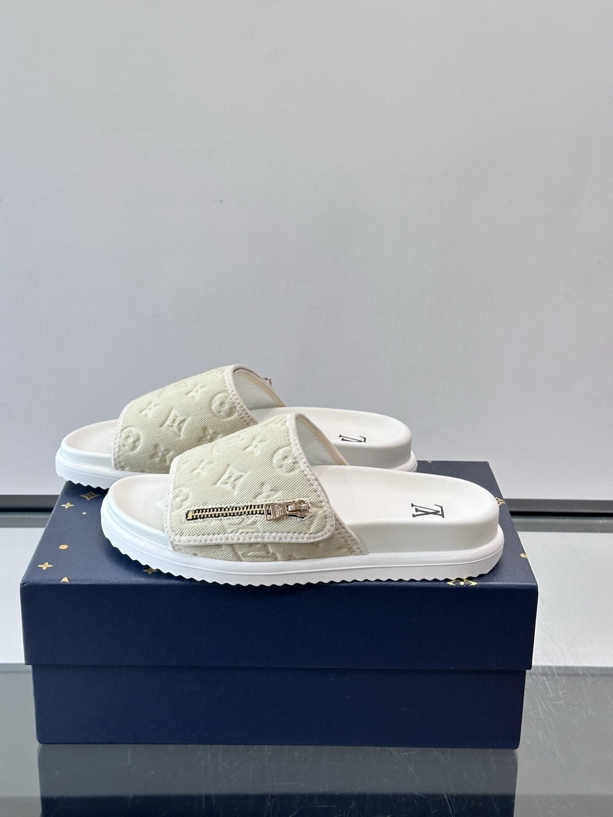 Louis Vuitton Embossed Monogram Slide Sandals — hero