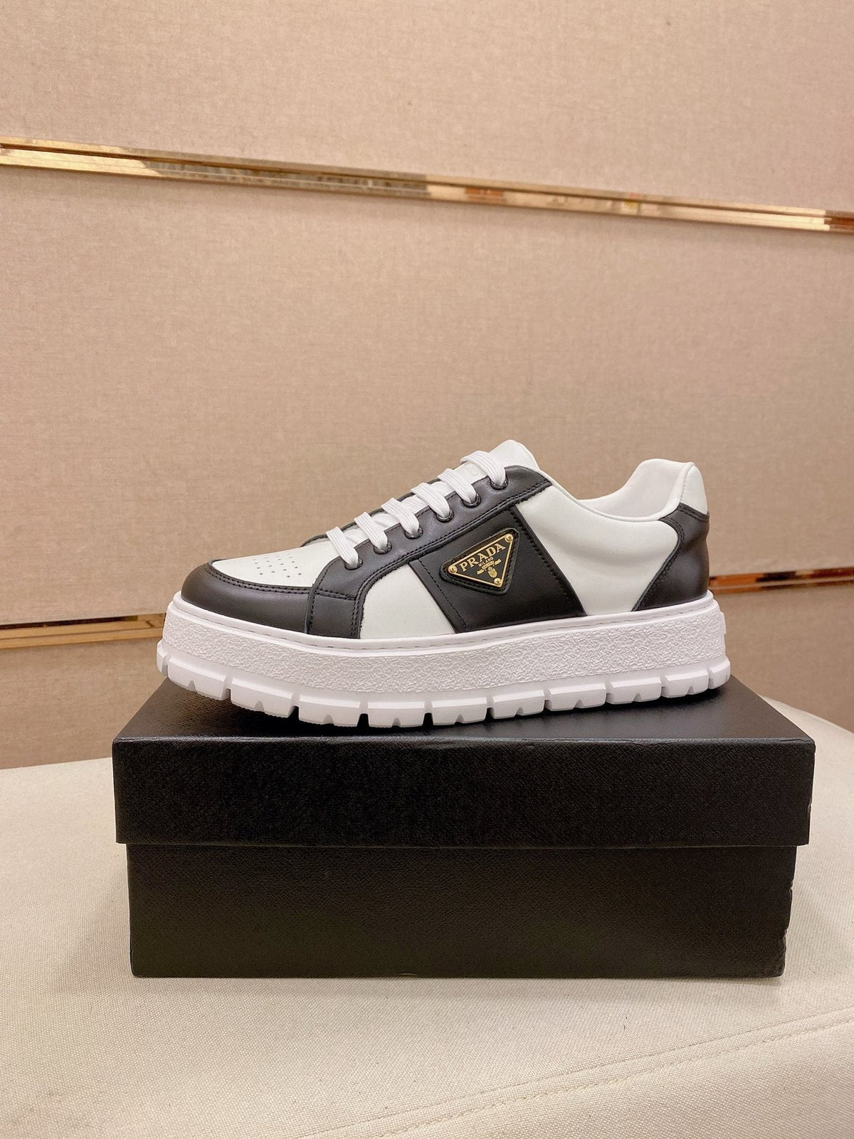 Prada Triangle Plaque Low-Top Sneakers — front