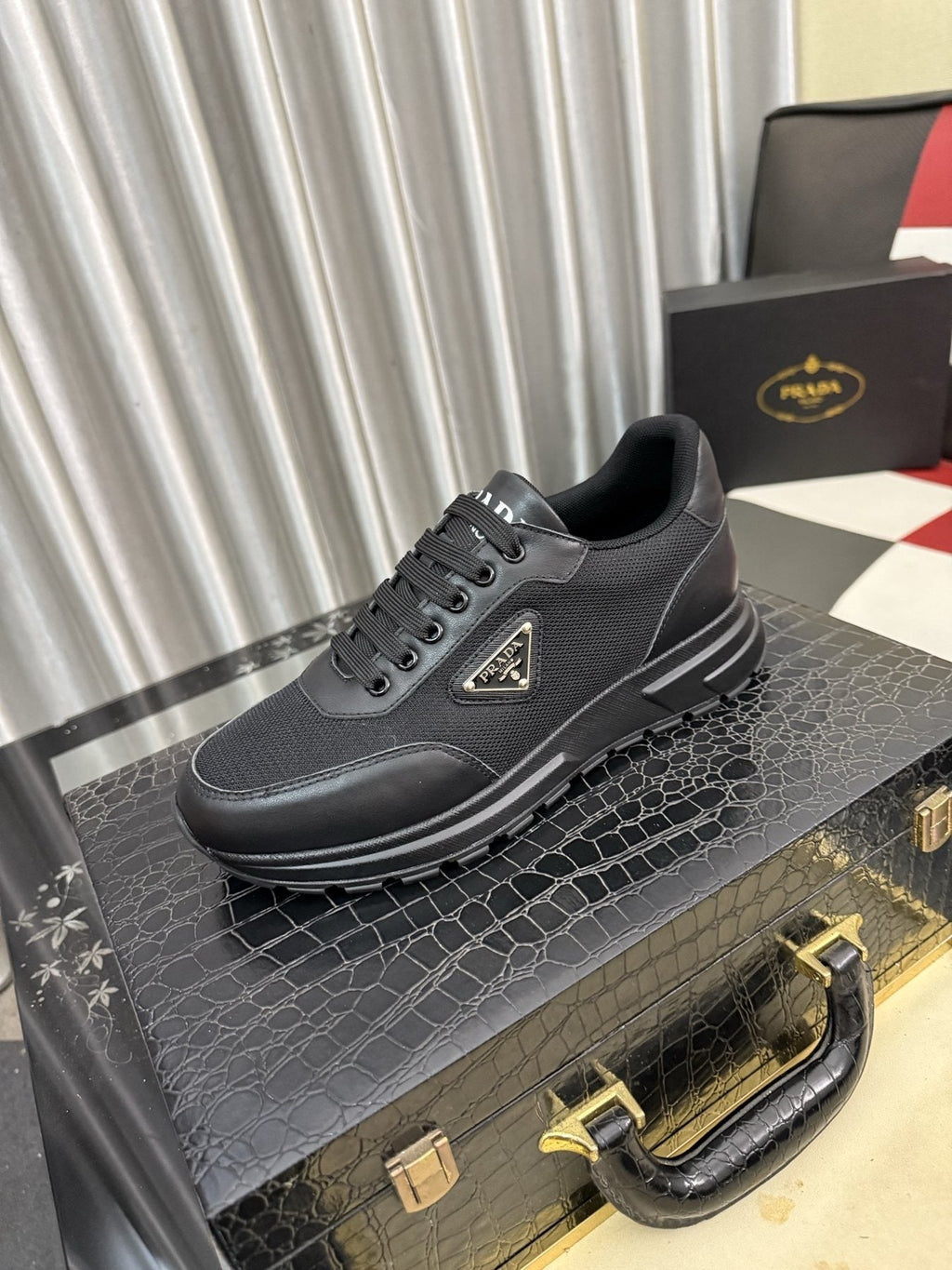 Prada Triangle Plaque Low-Top Sneakers — front