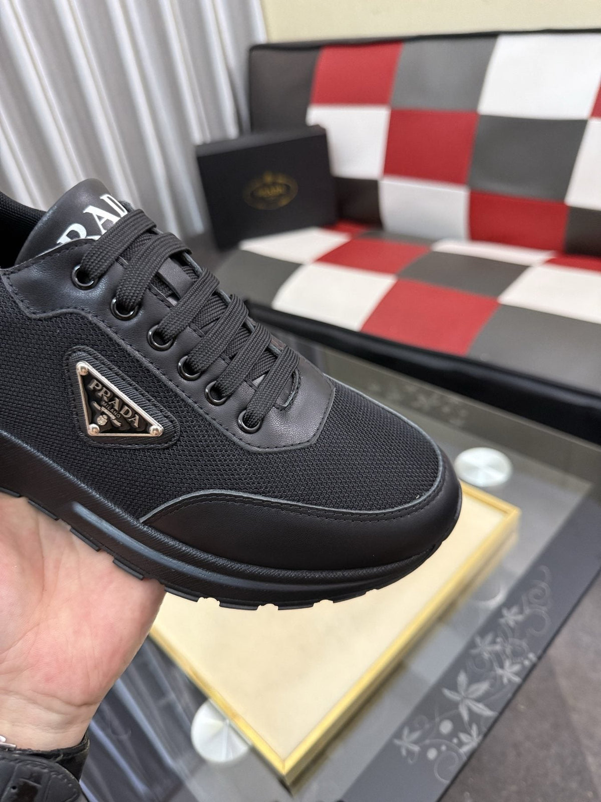 Prada Triangle Plaque Low-Top Sneakers — detail