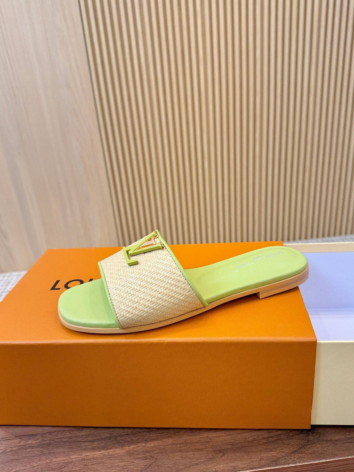 Louis Vuitton Textured Logo Slide Sandals — front