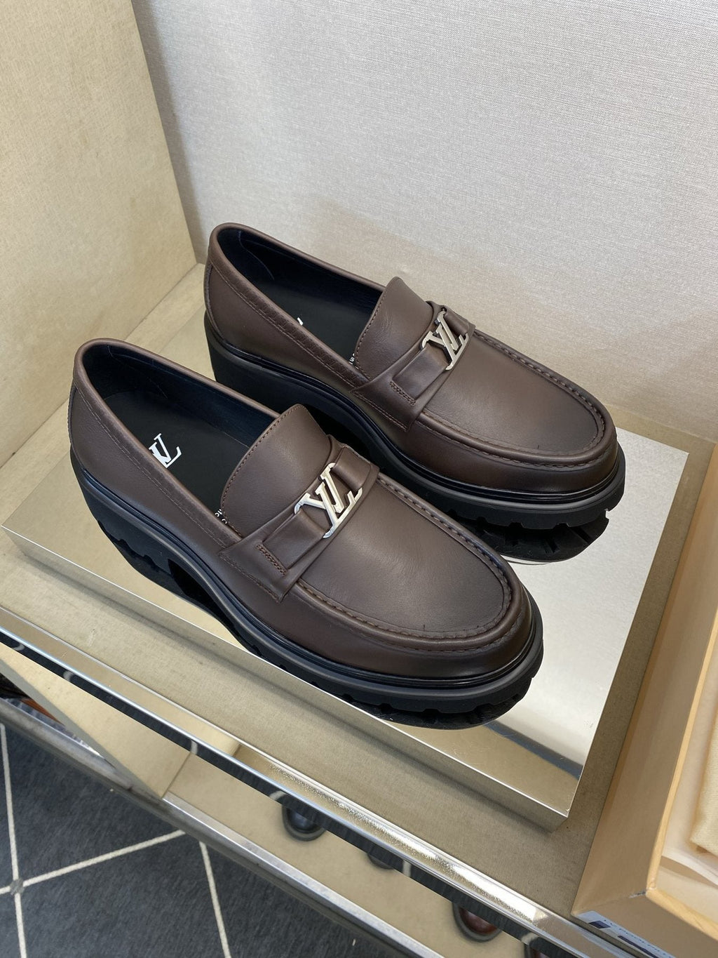 Louis Vuitton Metal Logo Loafers — front