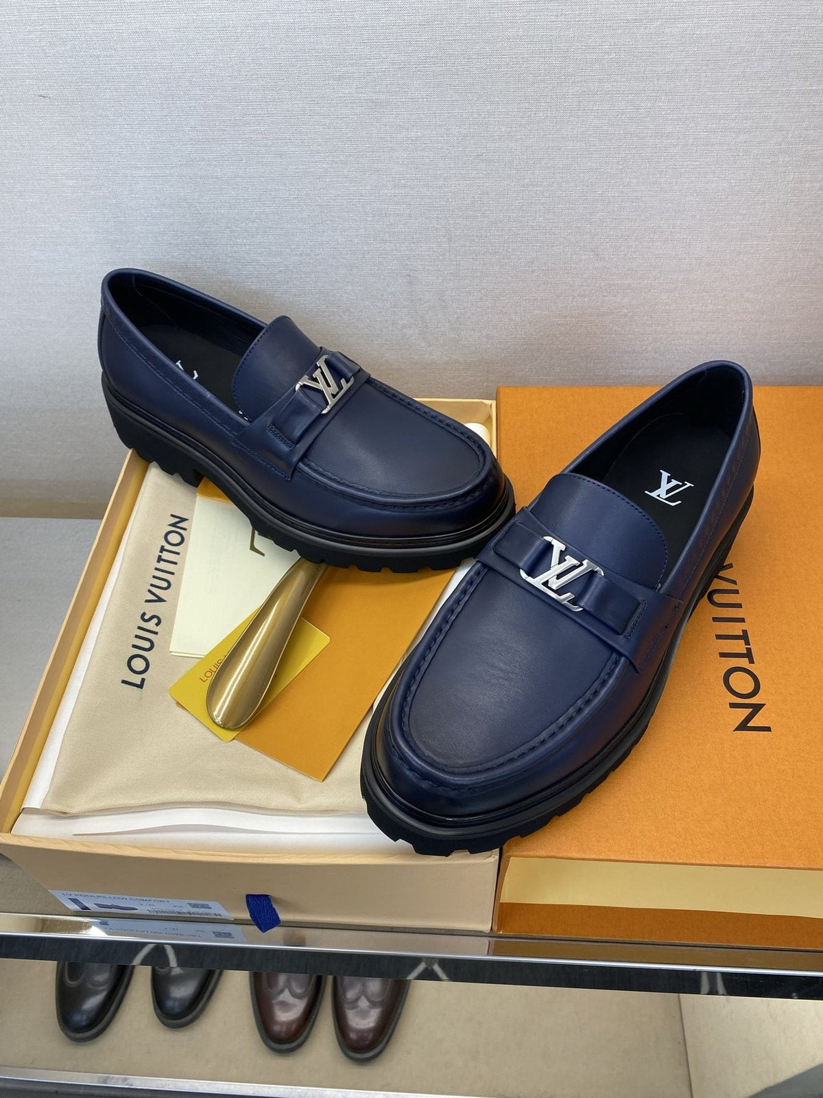 Louis Vuitton Metal Logo Loafers — front
