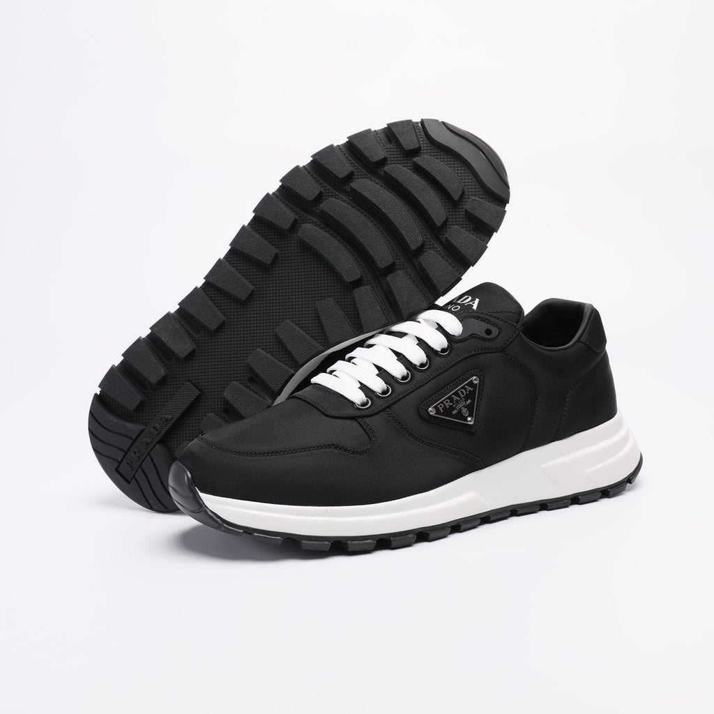 PRADA Navy Triangle Badge Sneakers — detail