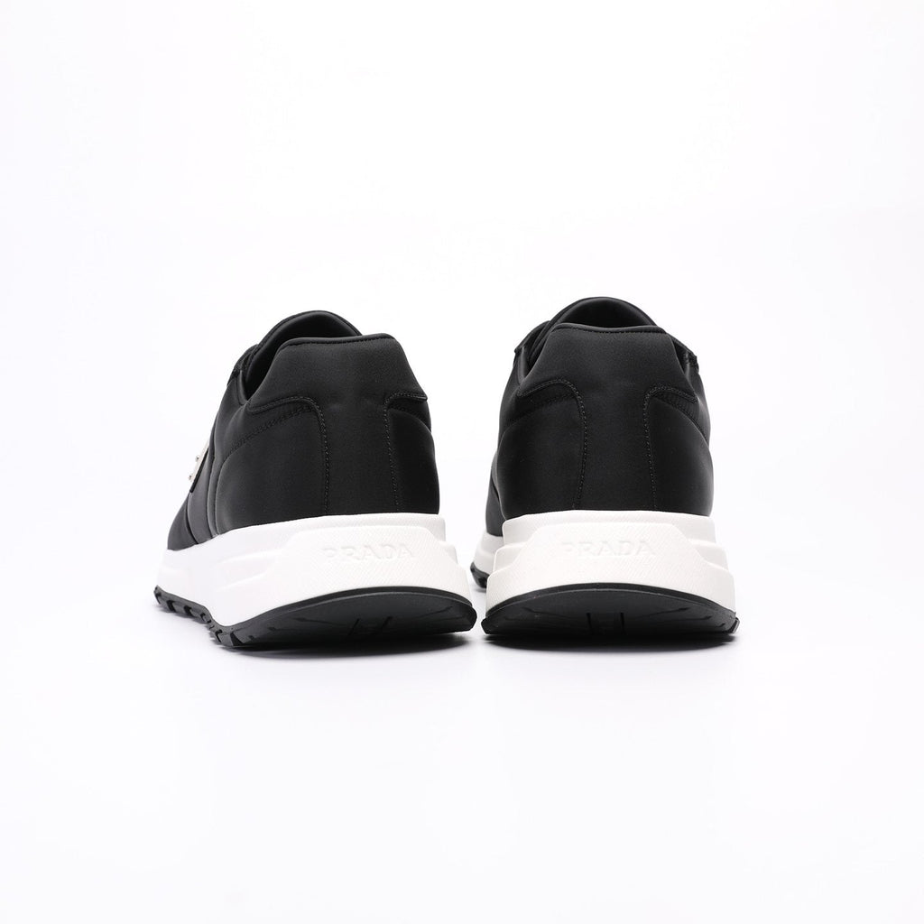 PRADA Navy Triangle Badge Sneakers — front