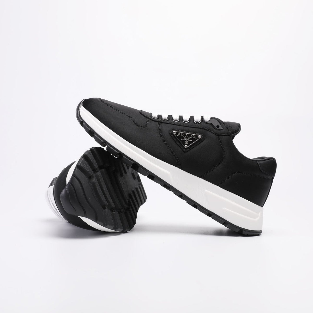 PRADA Navy Triangle Badge Sneakers — side