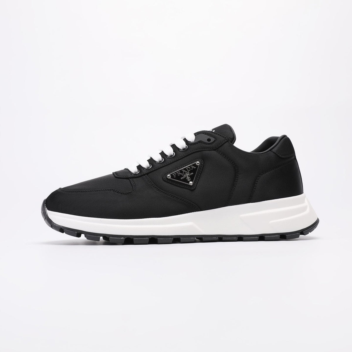 PRADA Navy Triangle Badge Sneakers — side