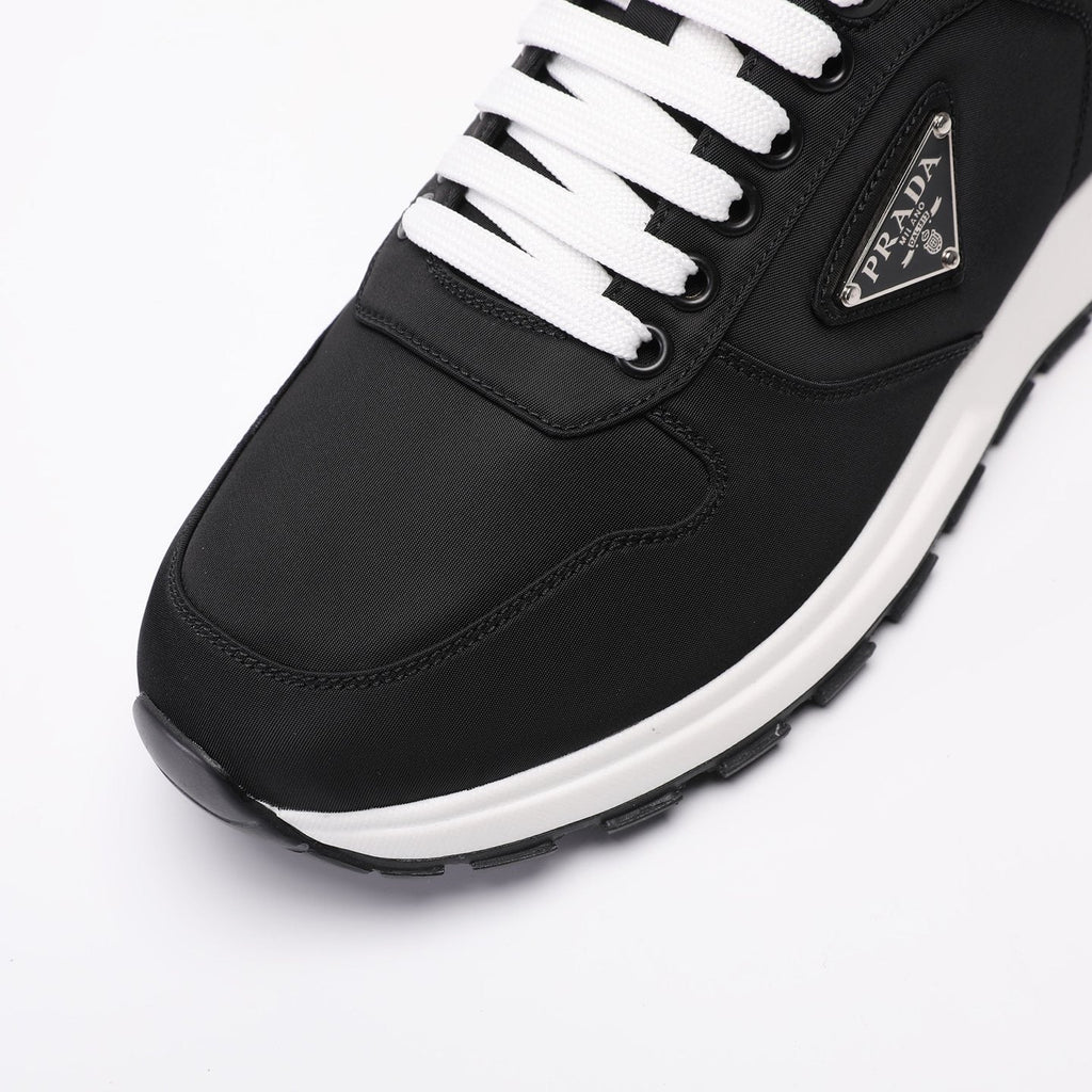 PRADA Navy Triangle Badge Sneakers — back