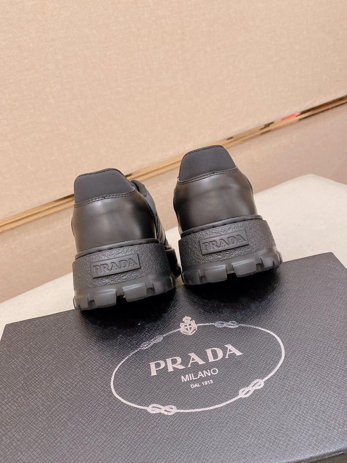 Prada Triangle Plaque Low-Top Sneakers — back