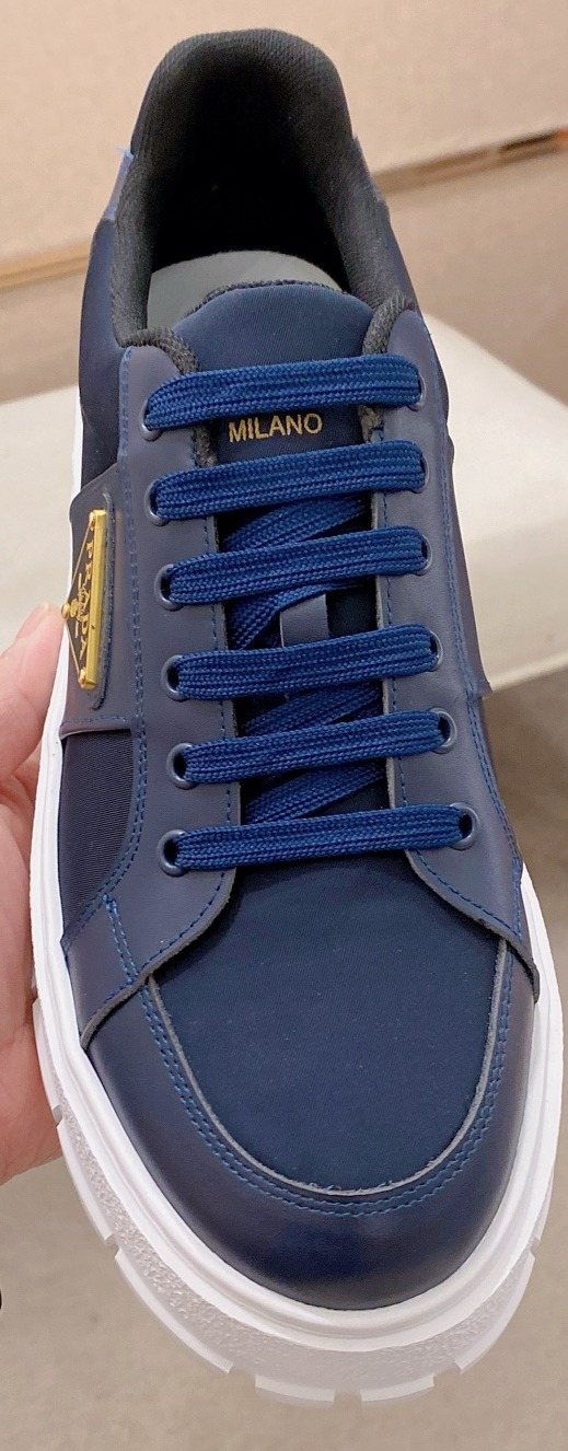 Prada Triangle Plaque Low-Top Sneakers — hero