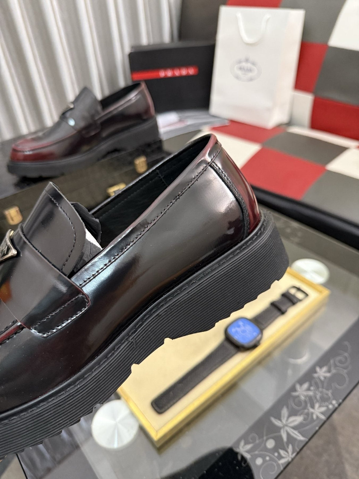 Prada Triangle Plaque Loafers — detail