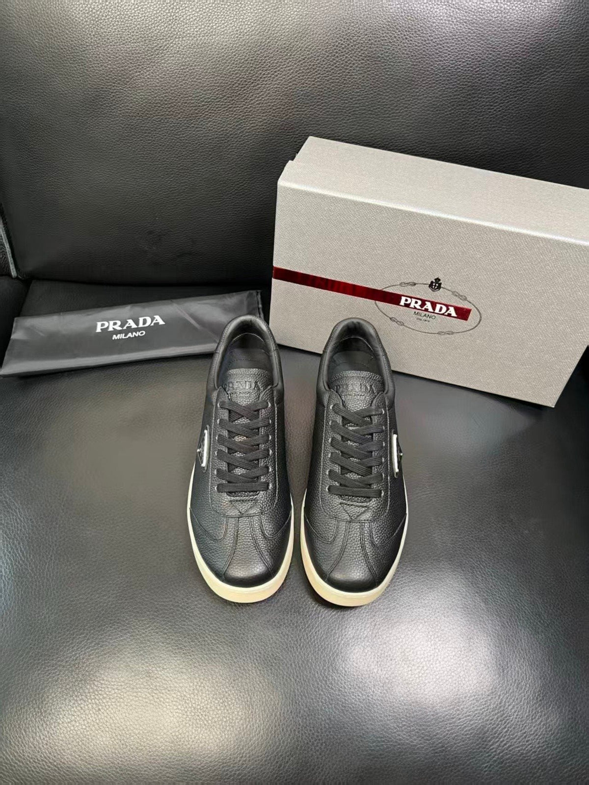 Prada Triangle Logo Low-Top Sneakers — front