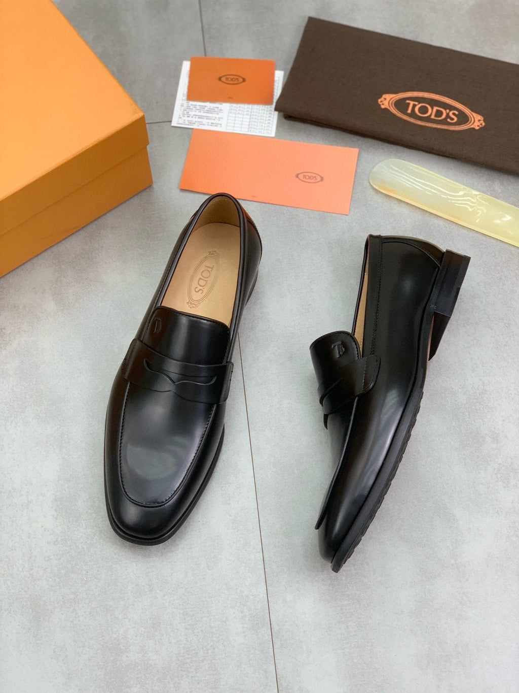 Tod's Black Penny Loafers — front