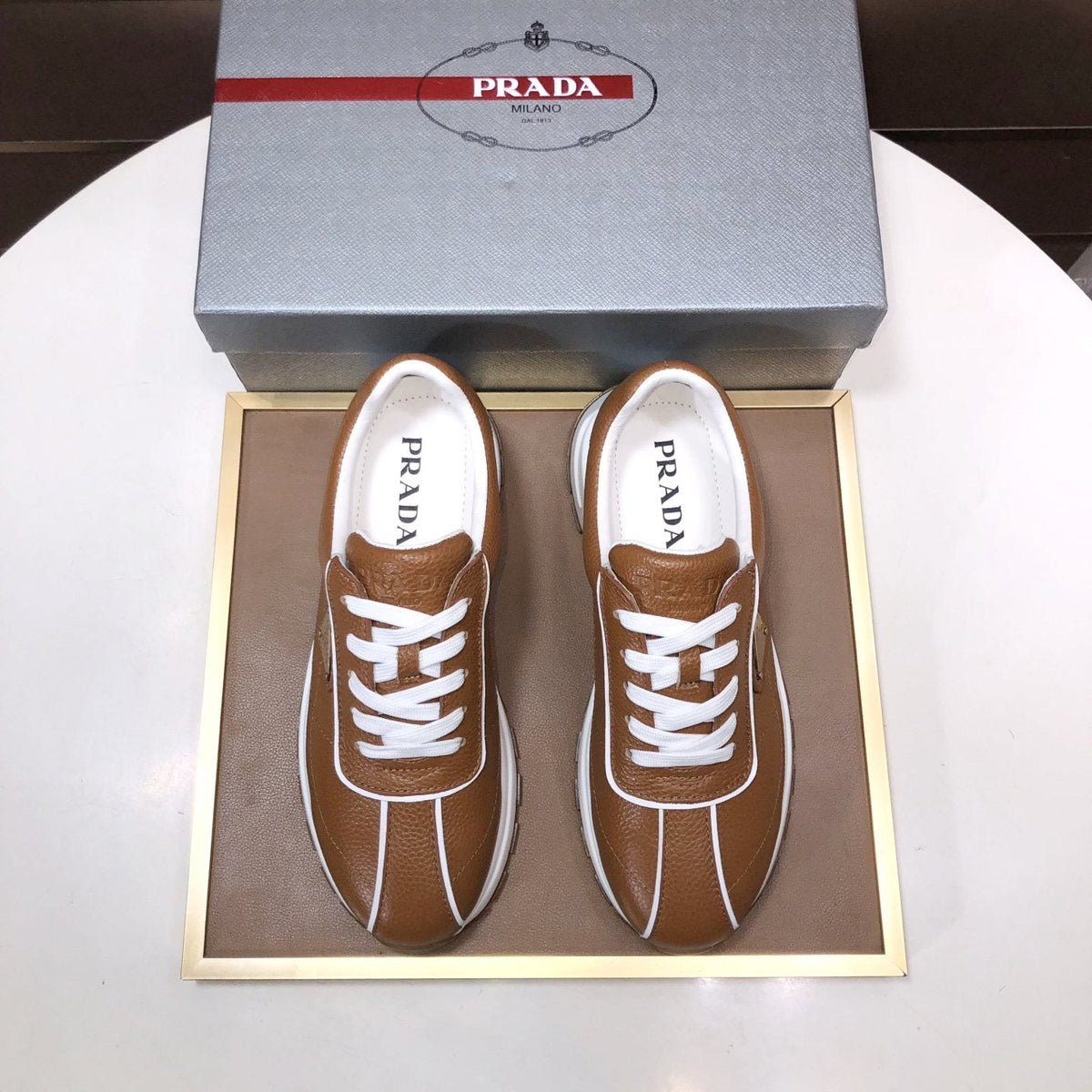 Prada Triangle Plaque Low-Top Sneakers — front