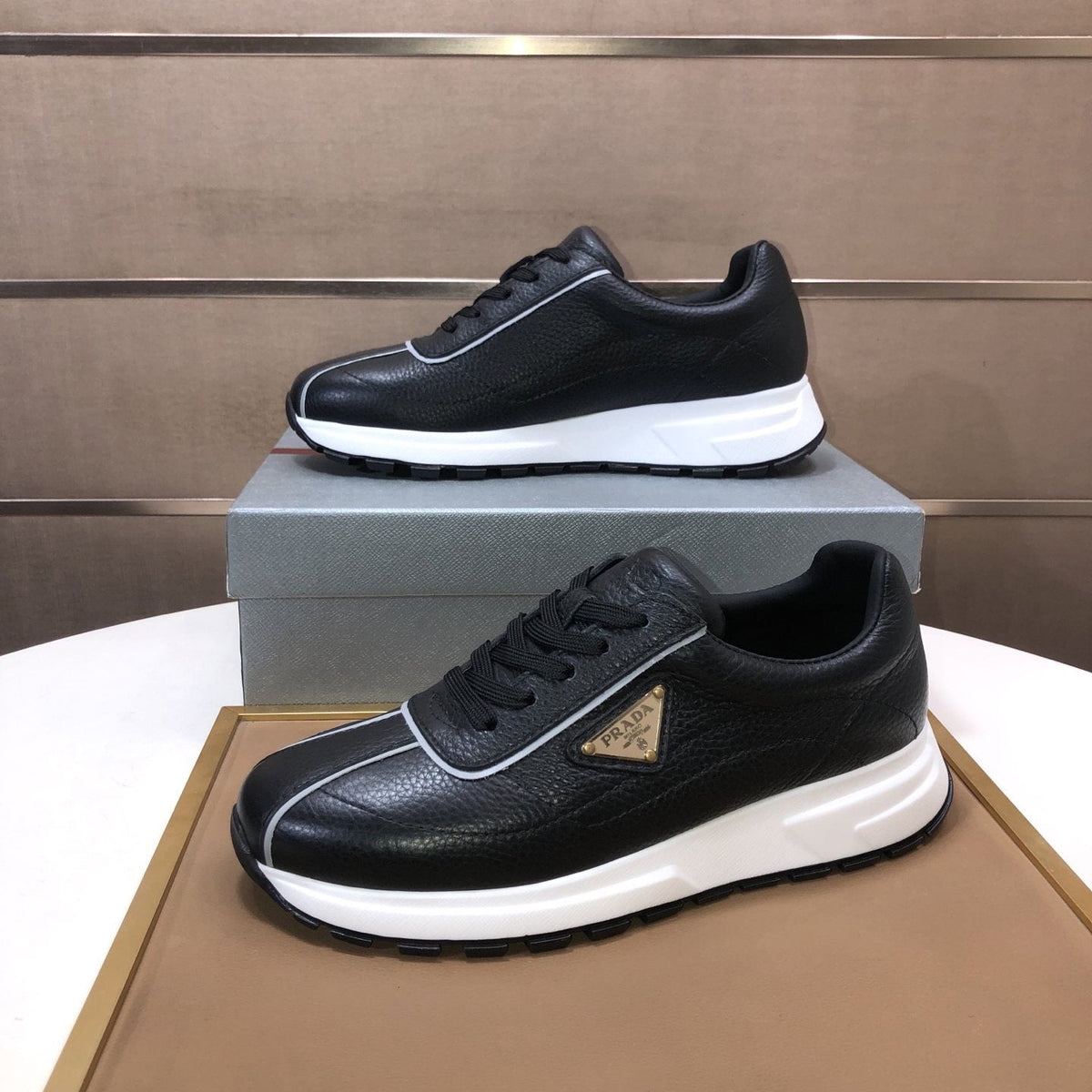 Prada Triangle Plaque Low-Top Sneakers — front