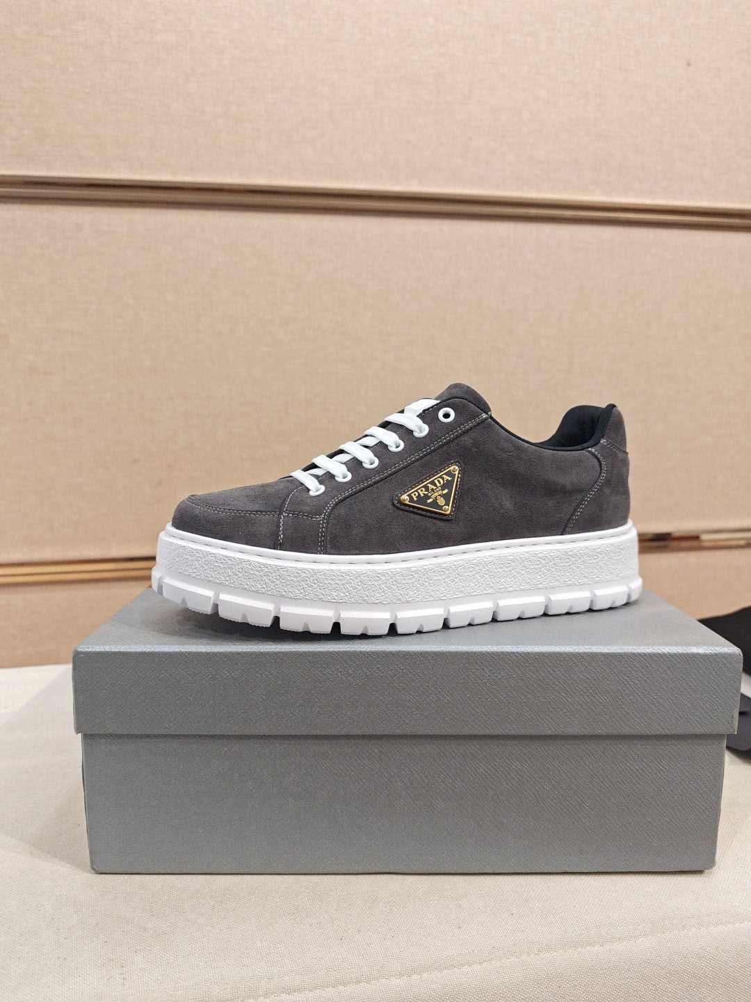Prada Triangle Plaque Low-Top Sneakers — front