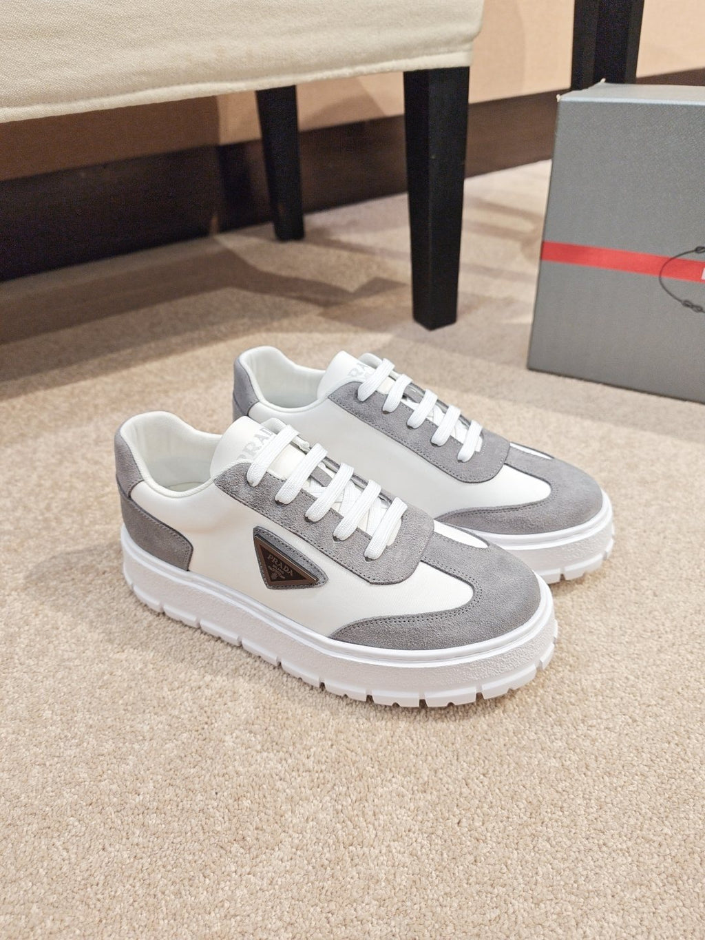 Prada Triangle Plaque Low-Top Sneakers — front