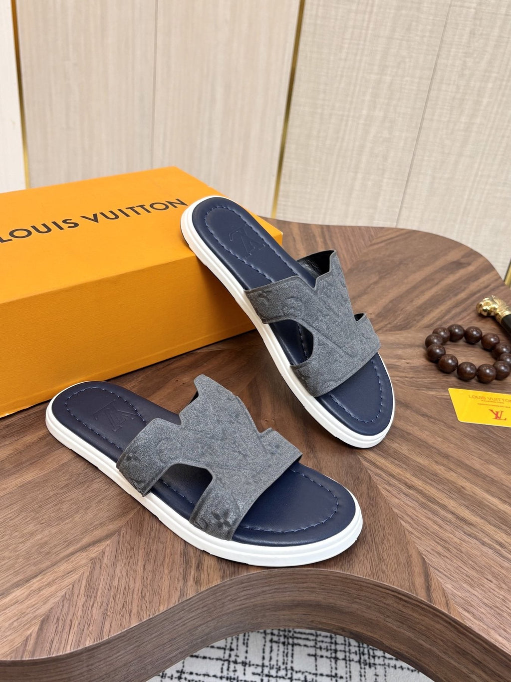 Louis Vuitton Embossed Navy Blue Slide Sandals — model