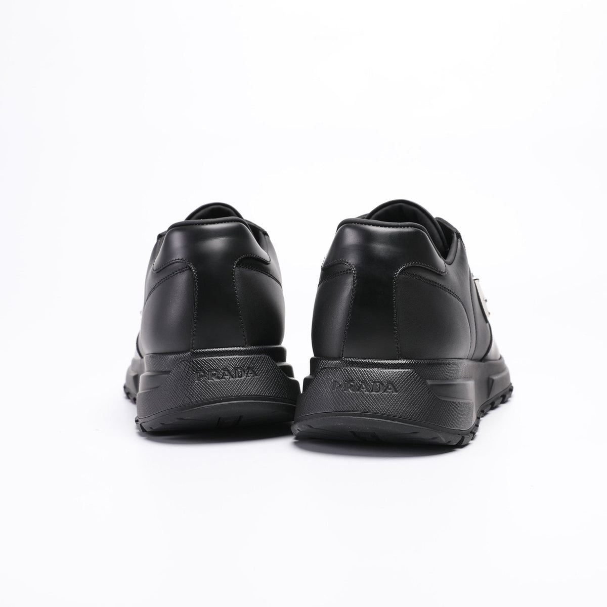 Prada Triangle Plaque Low-Top Sneakers — back