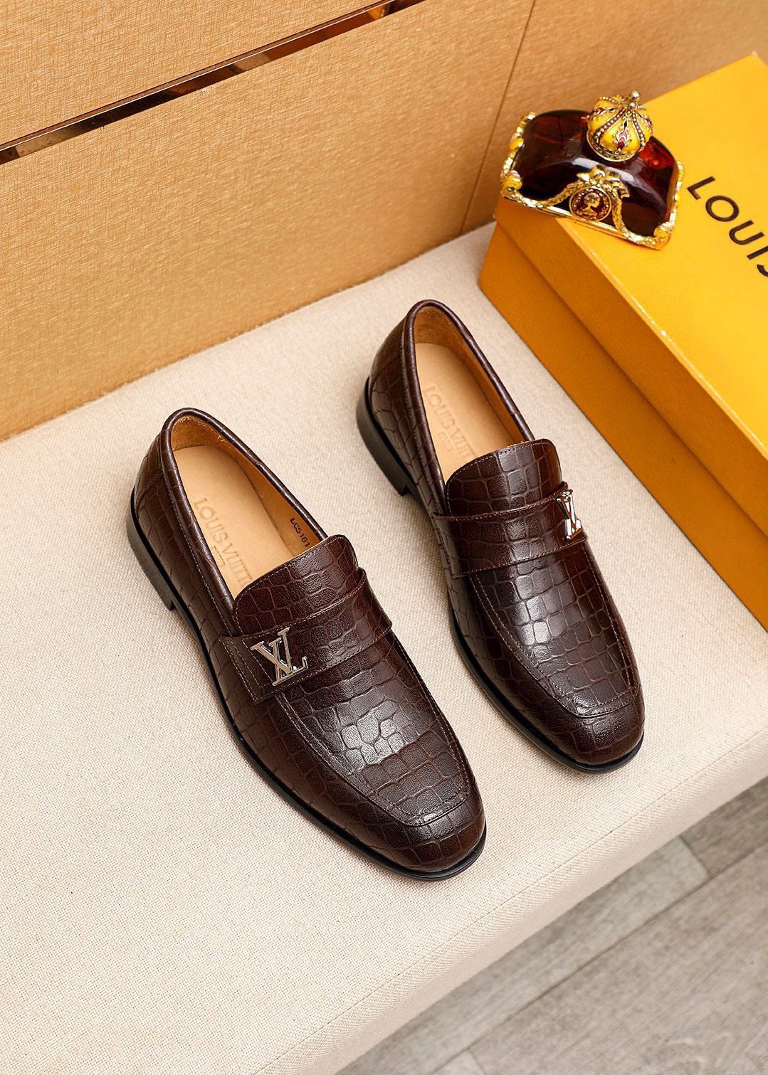 Louis Vuitton Embossed Metal-Accent Loafers — front
