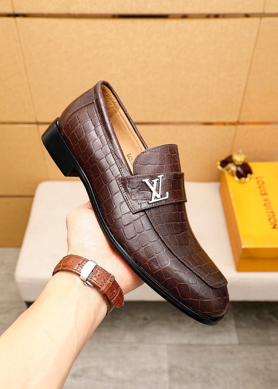 Louis Vuitton Embossed Metal-Accent Loafers — model