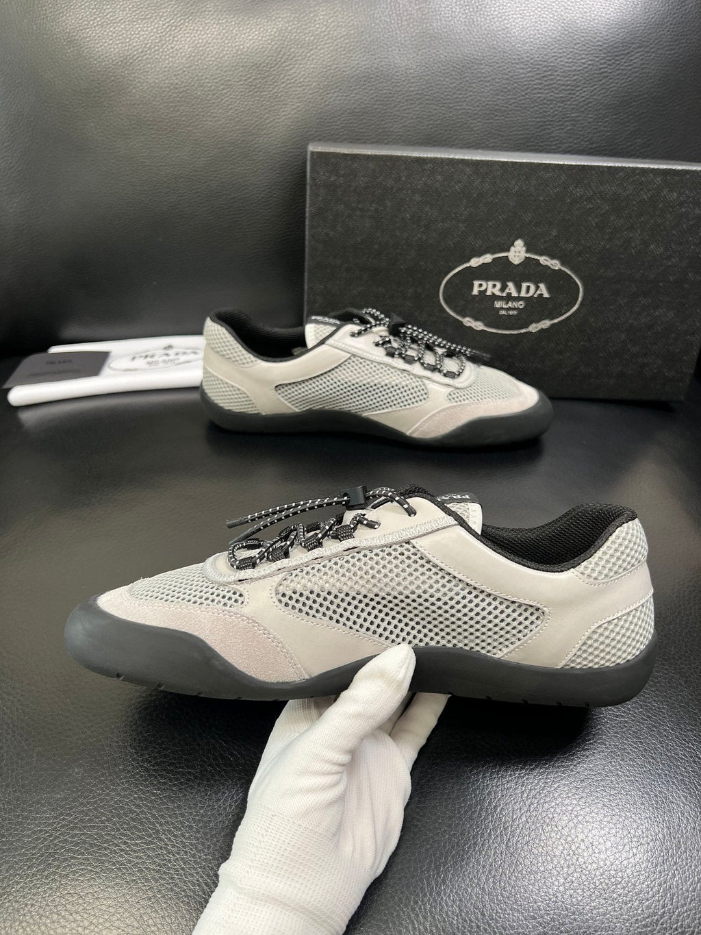 Prada White, Gray & Black Low-Top Sneakers — model