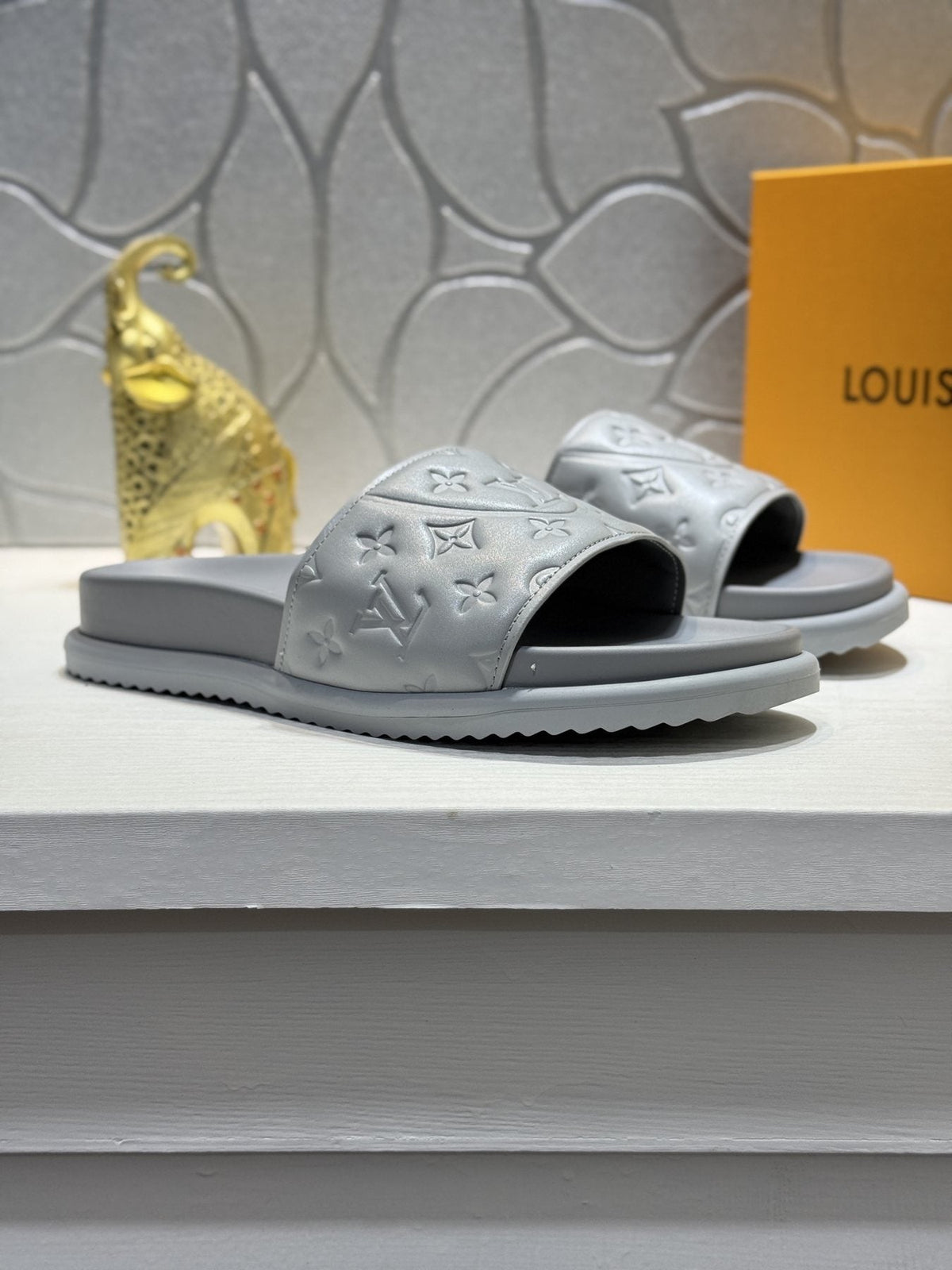 Louis Vuitton Embossed Slide Sandals — front